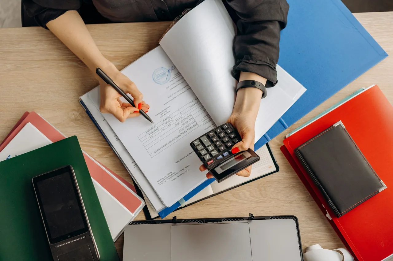 Reviewing business records with a calculator