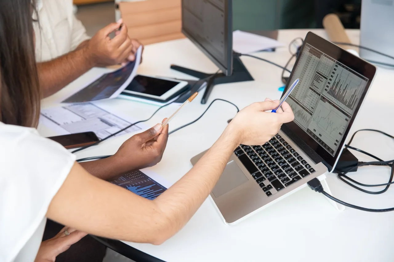 Professionals reviewing business information
